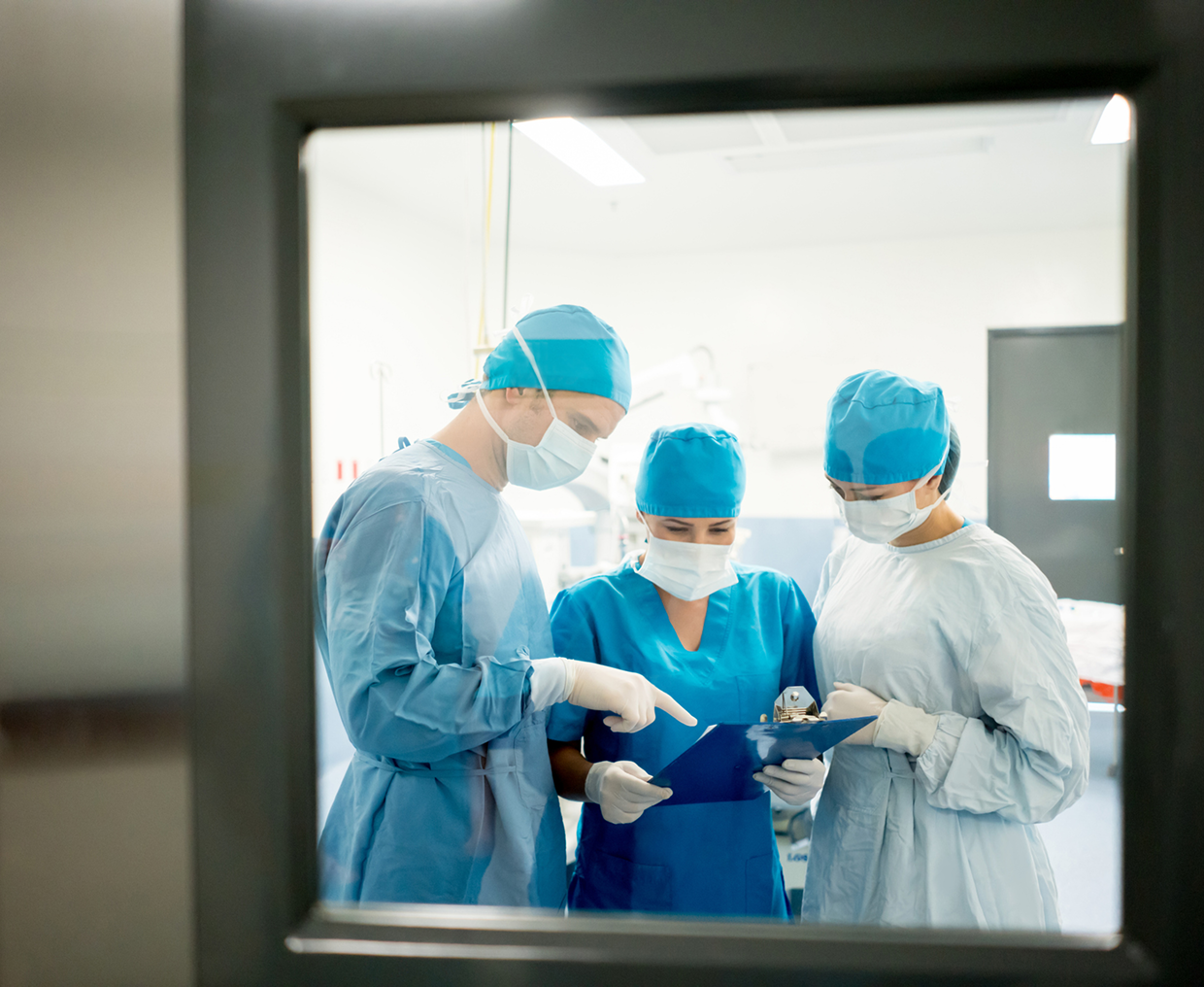 Surgeons collaborating in hospital setting