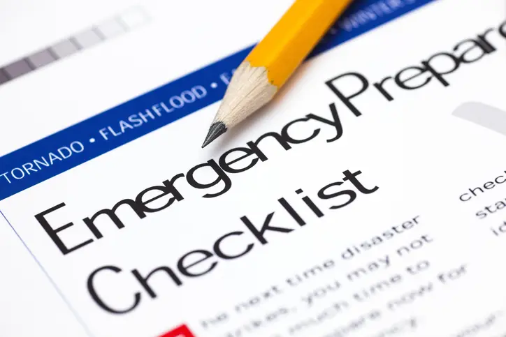 Emergency Preparedness Checklist with pencil. Close-up.